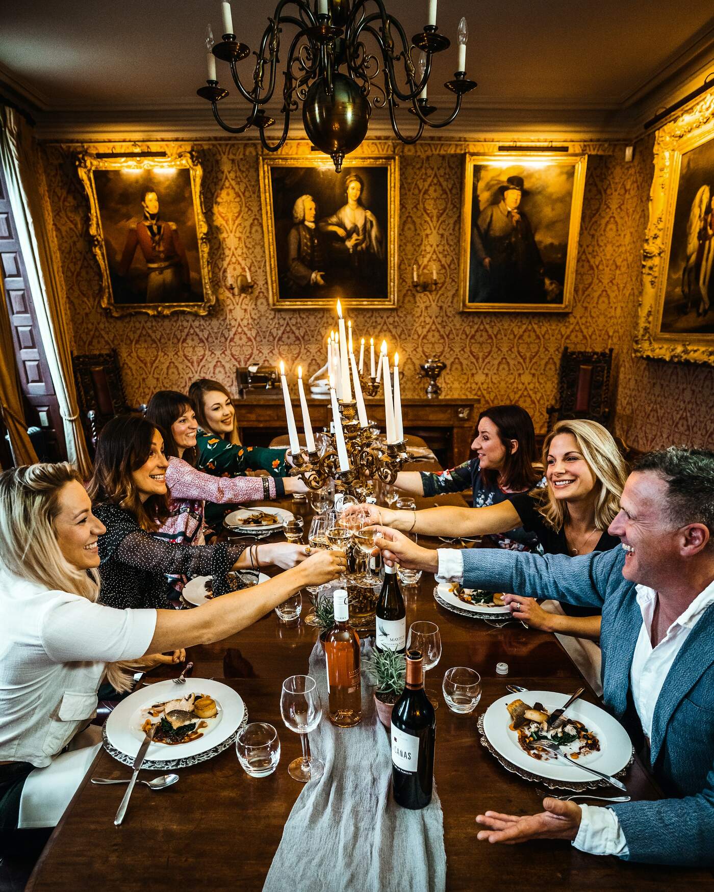 Friends sharing a meal around a long table