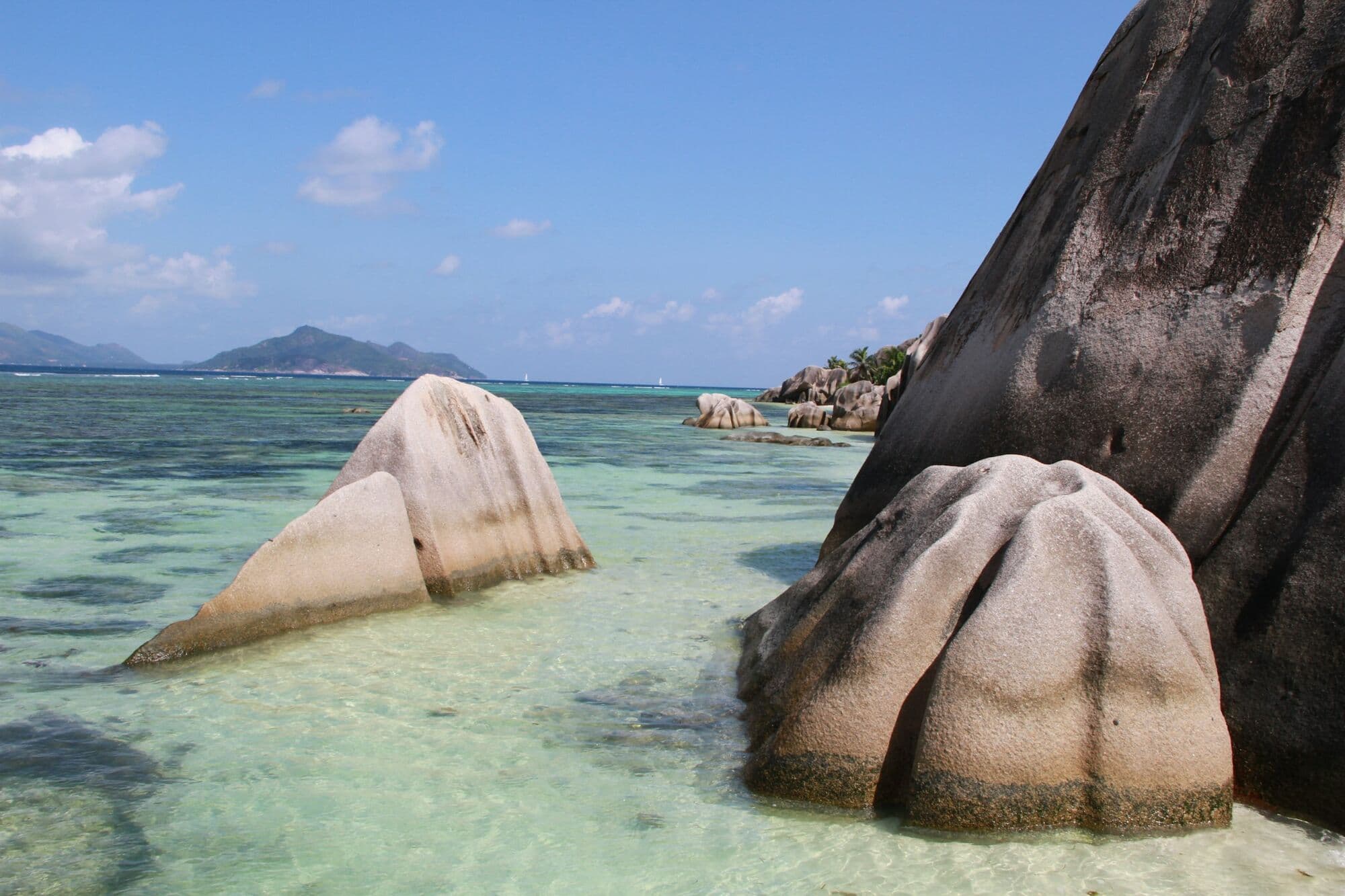 Smooth granite boulders on the white sand at Anse Source d'Argent, La Digue, Seychelles